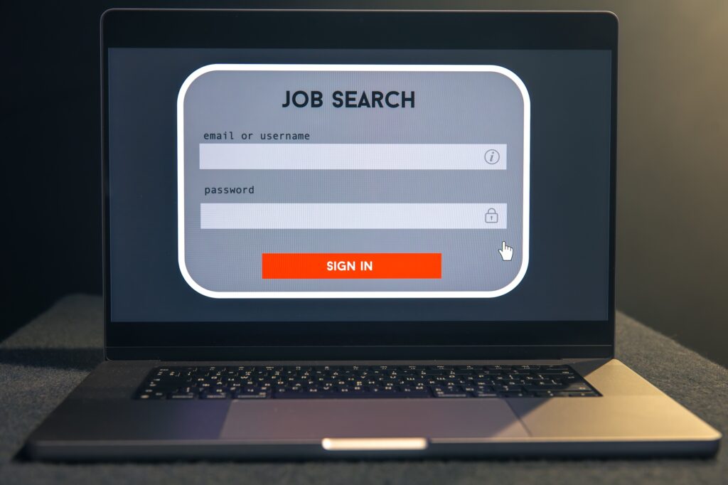 Laptop screen displaying a job search login interface, representing digital hiring tools and the ease of connecting with a staffing consultant near me for employment support.